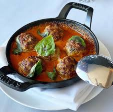 Monarch Restaurant signature dishes Wood Fired Meatballs, Texas Wagyu Carpaccio, Fire Roasted Lasagna Diane.